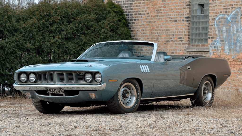 An image of a Plymouth Hemi Cuda Convertible parked outdoors.
