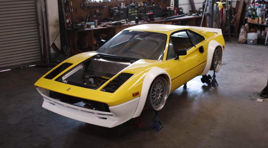 An image of a widebody Ferrari in a workshop.