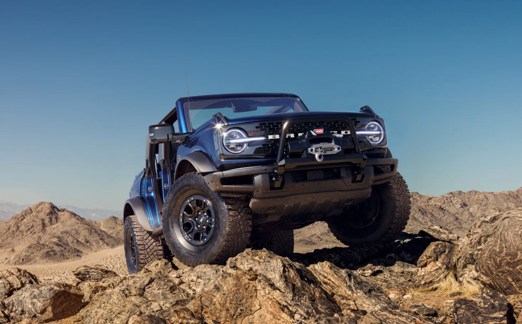 The 2021 Ford Bronco crawling over rocks. 