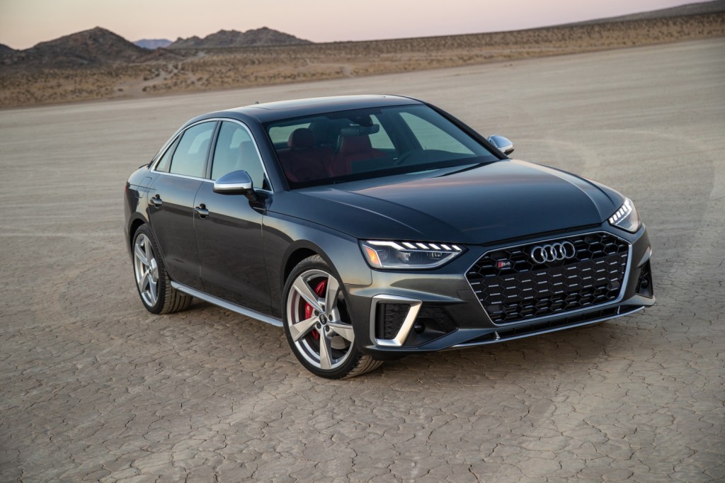 A grey 2021 Audi S4 in the desert at sunset