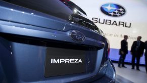 The rear of a Fuji Heavy Industries Ltd. blue Subaru 2012 Impreza hatchback vehicle is seen at the New York International Auto Show (NYIAS) in New York