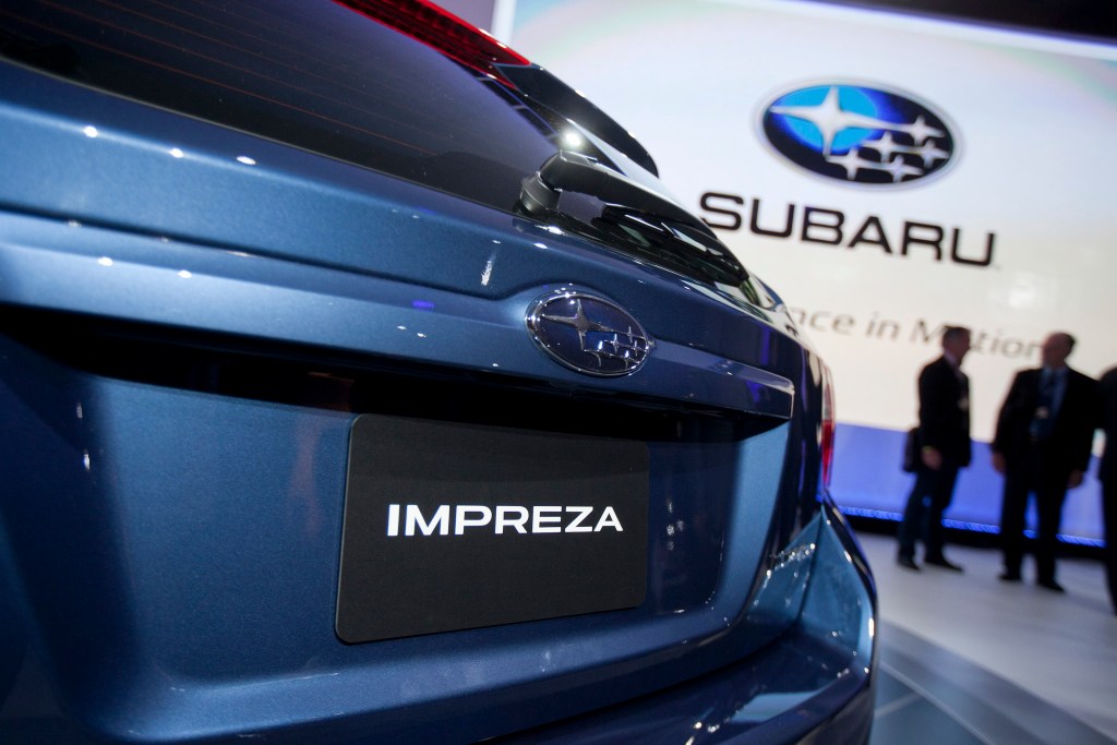 The rear of a Fuji Heavy Industries Ltd. blue Subaru 2012 Impreza hatchback vehicle is seen at the New York International Auto Show (NYIAS) in New York