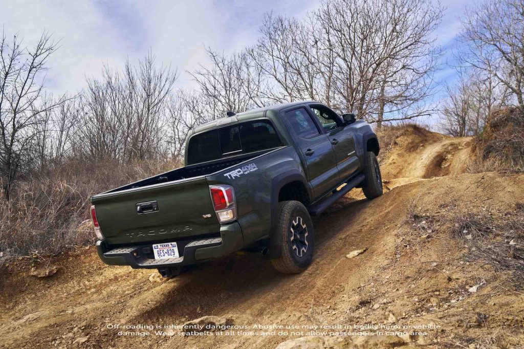 a rear shot of the 2021 Toyota Tacoma Off Road with TRD Lift Kit driving off road