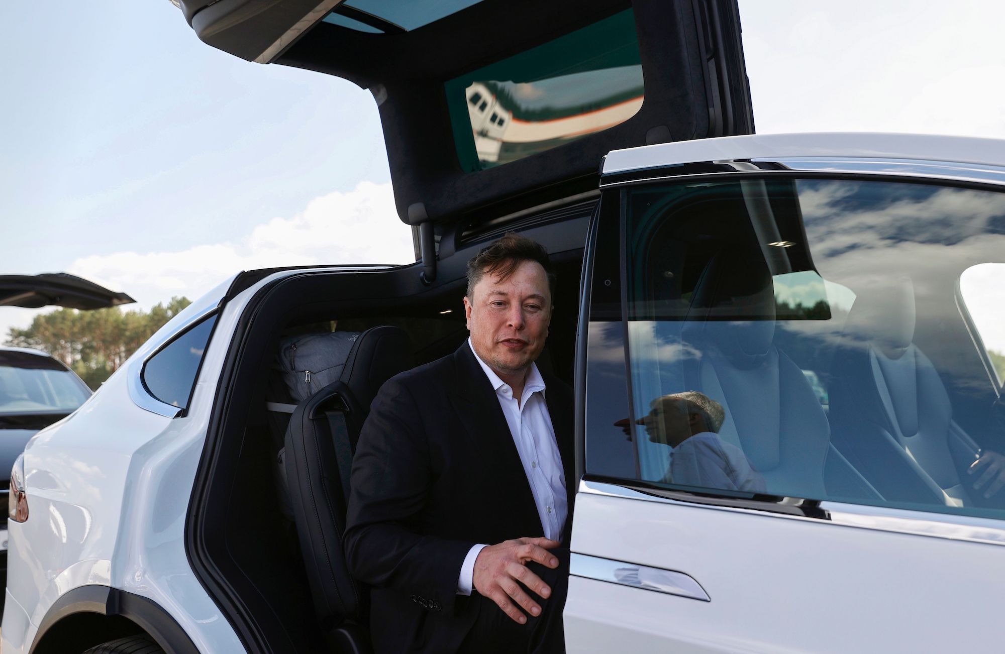 Tesla CEO Elon Musk gets into a white Tesla Model X SUV after talking to media on September 3, 2020, in Gruenheide, Germany
