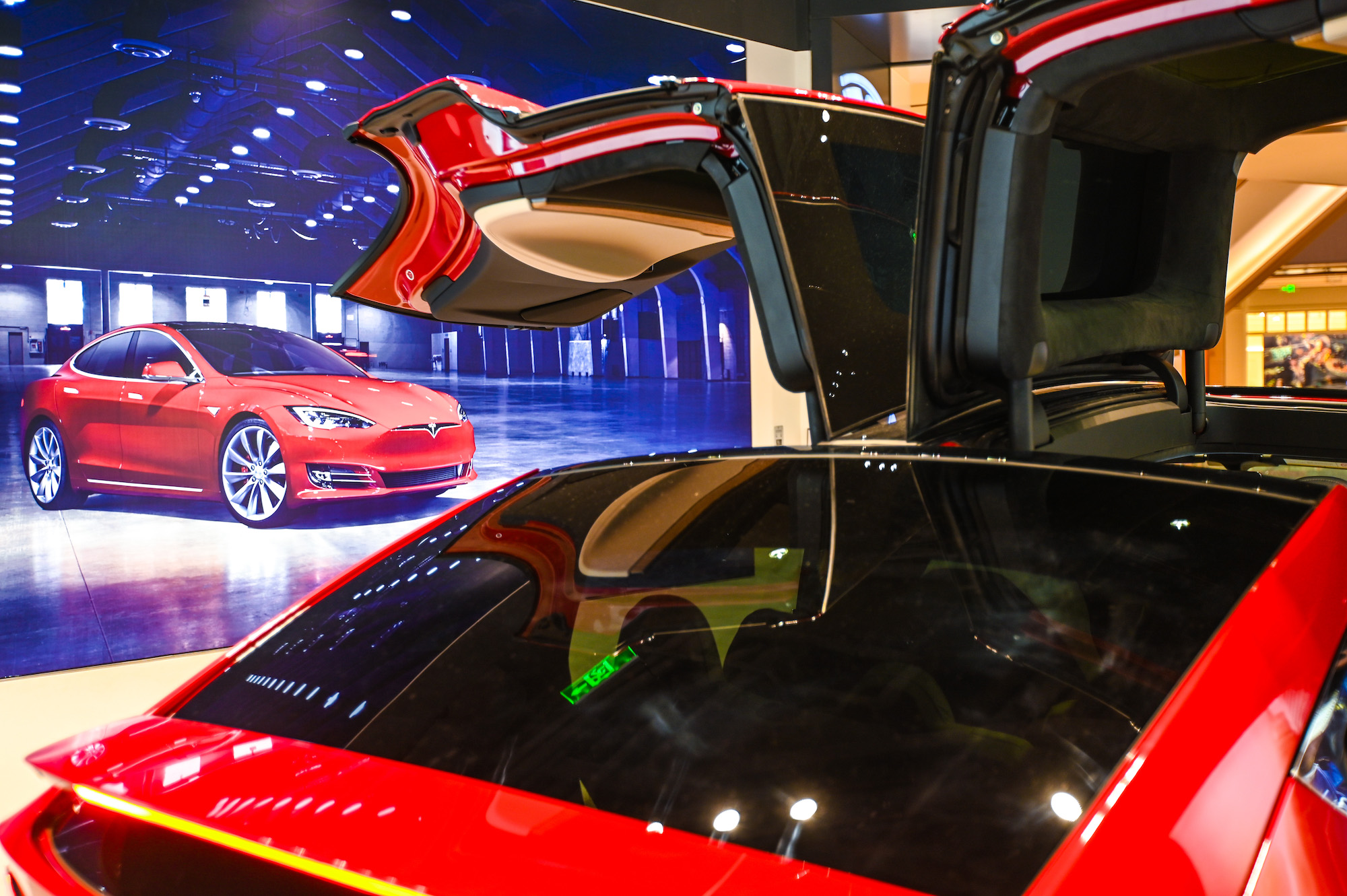 A red Tesla Model X electric SUV parked in a showroom in Shanghai, China, on January 4, 2021