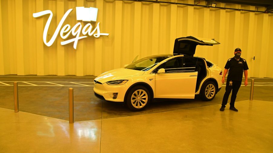 A white Tesla Model X is parked with the gull-wing doors up in the Central Station during a media preview of the Las Vegas Convention Center Loop