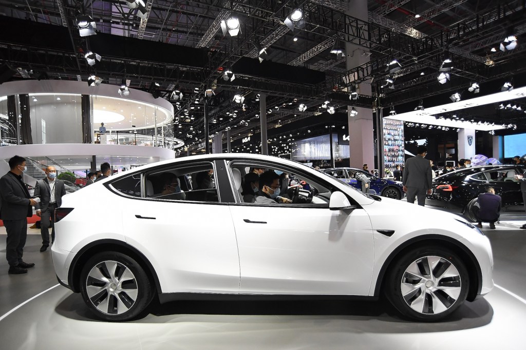 Pictured is a white Tesla Model Y, one of the best luxury EVs according to Truecar