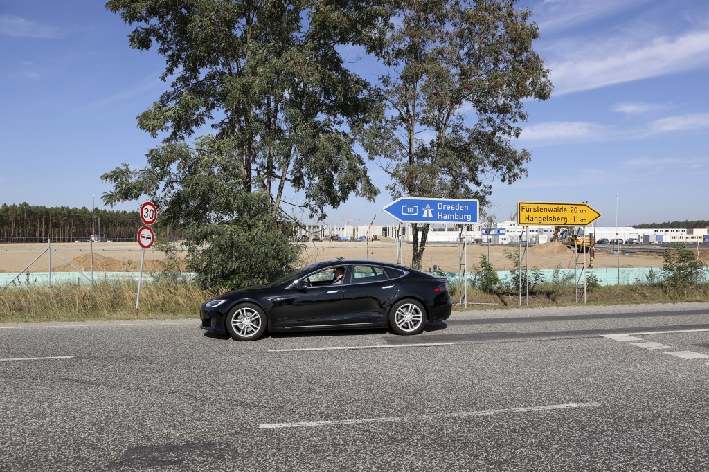 A Tesla Model S EV sedan on a highway