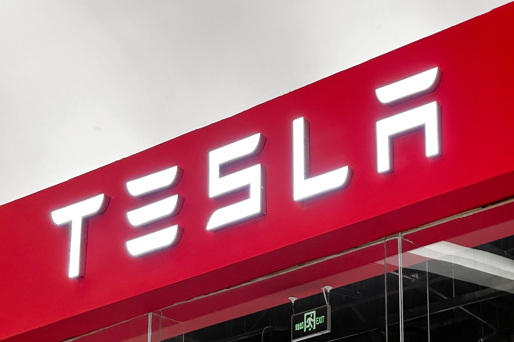 A red Tesla sign. 