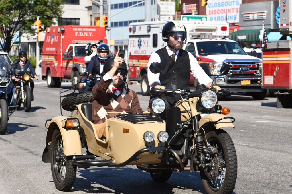 Two riders on a tan Ural motorcycle at the 2018 Distinguished Gentleman's Ride in New York City