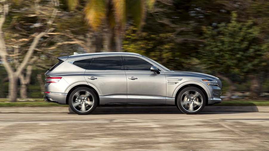 the 2021 genesis gv80 luxury crossover SUV at speed on a scenic road