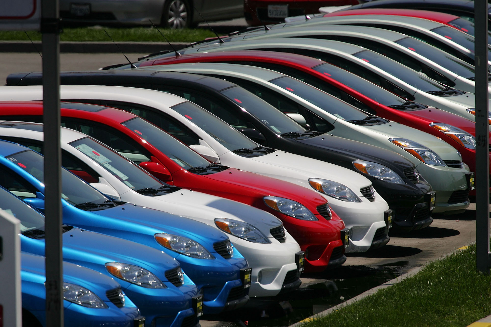 A row of Toyota vehicles in various car colors are parked in a line at the world's largest auto dealership, Longo Toyota, on April 24, 2007, in El Monte, California