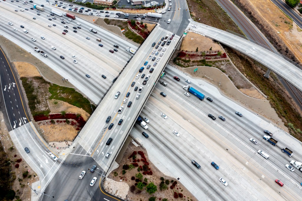 An aerial view of traffic on the 91 Freeway and the Green River Road overpass on May 20, 2021, in Corona, California