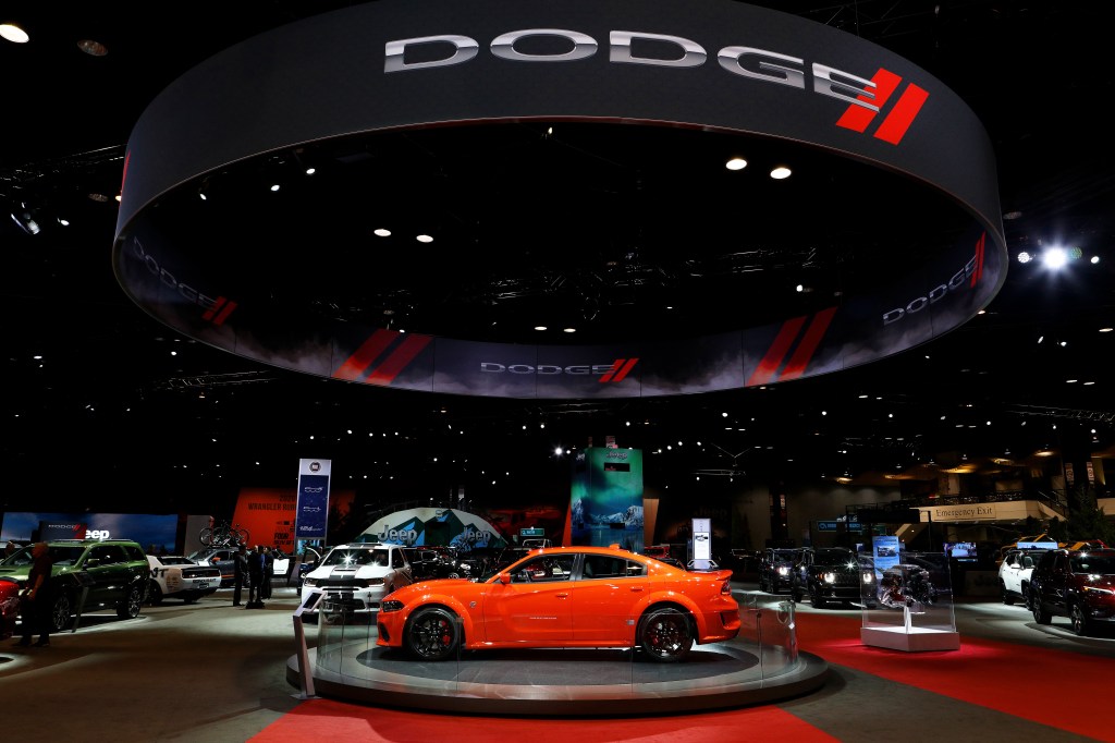 An orange dodge charger on display