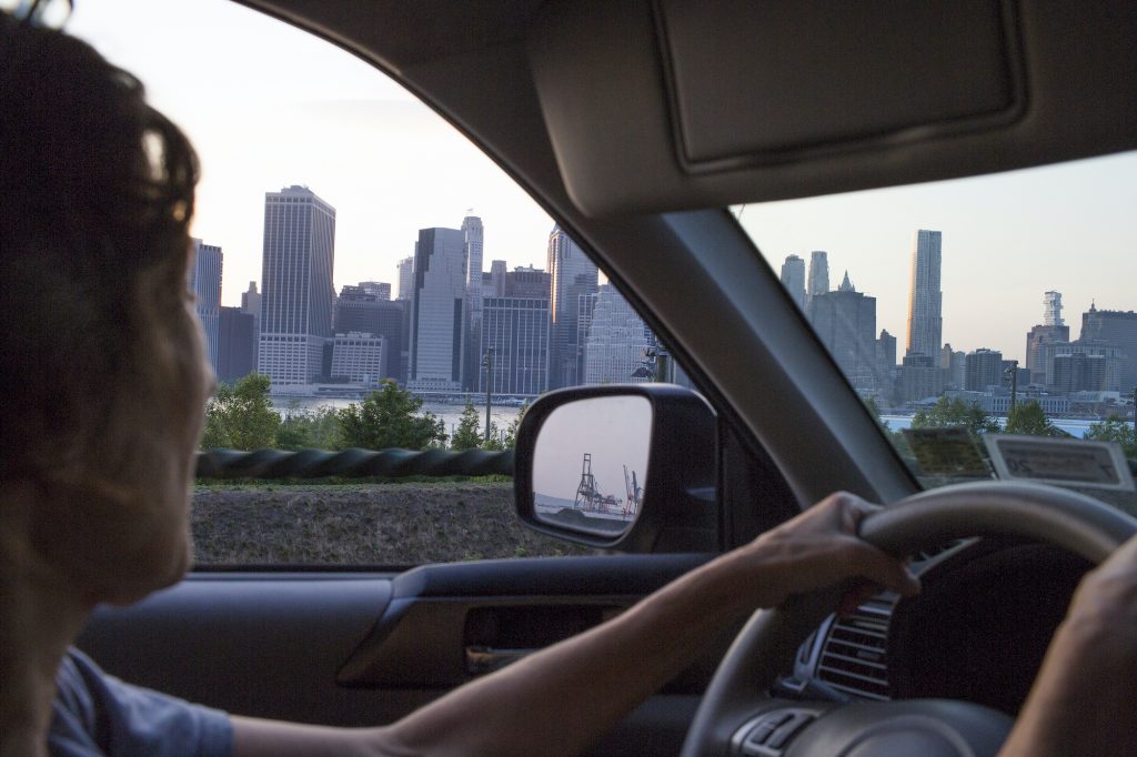 A woman drives along the Brooklyn Queens Expressway