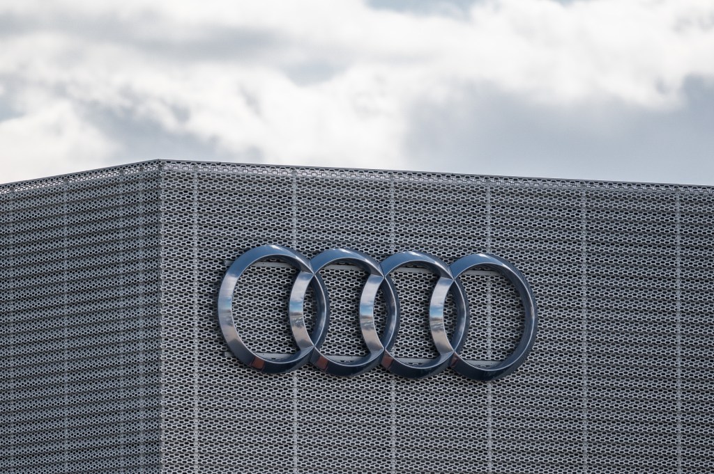 The exterior of Audi's office in Gdansk, showing their four rings logo on the corner of the building.