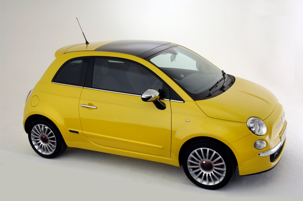 A yellow FIat 500 three door hatchback