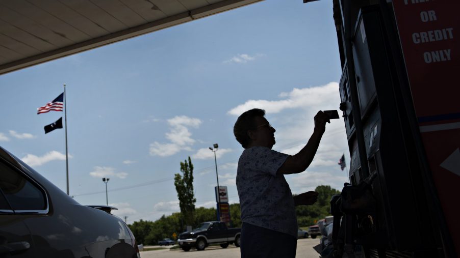A customer inserts a credit card into the gas pump. | Photographer: Daniel Acker/Bloomberg via Getty Images