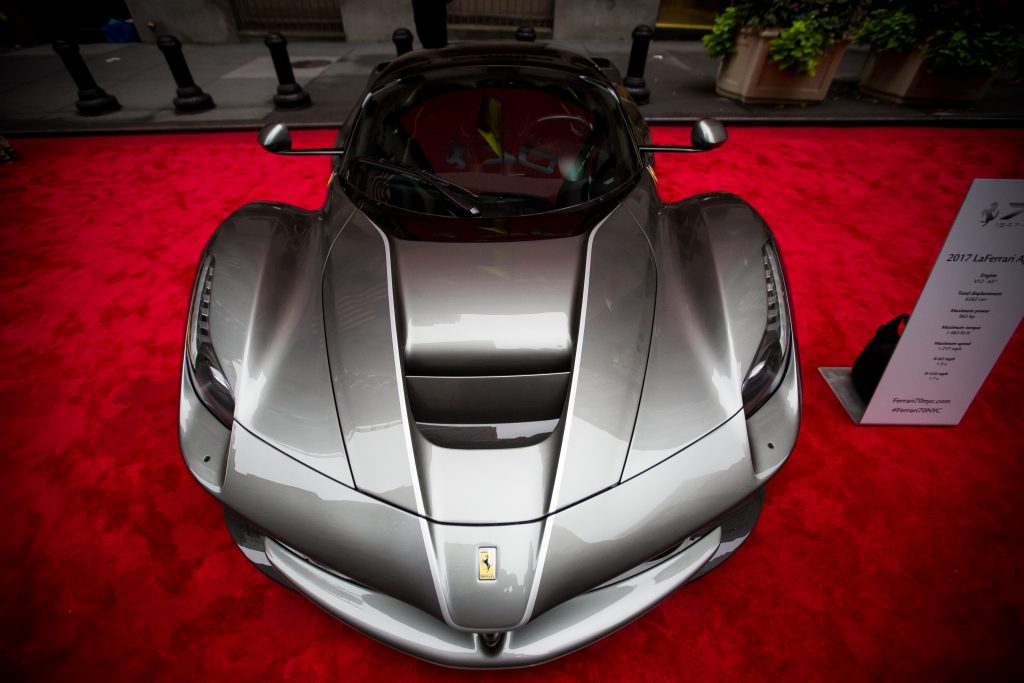 A silver Ferrari NV LaFerrari Aperta on the red carpet