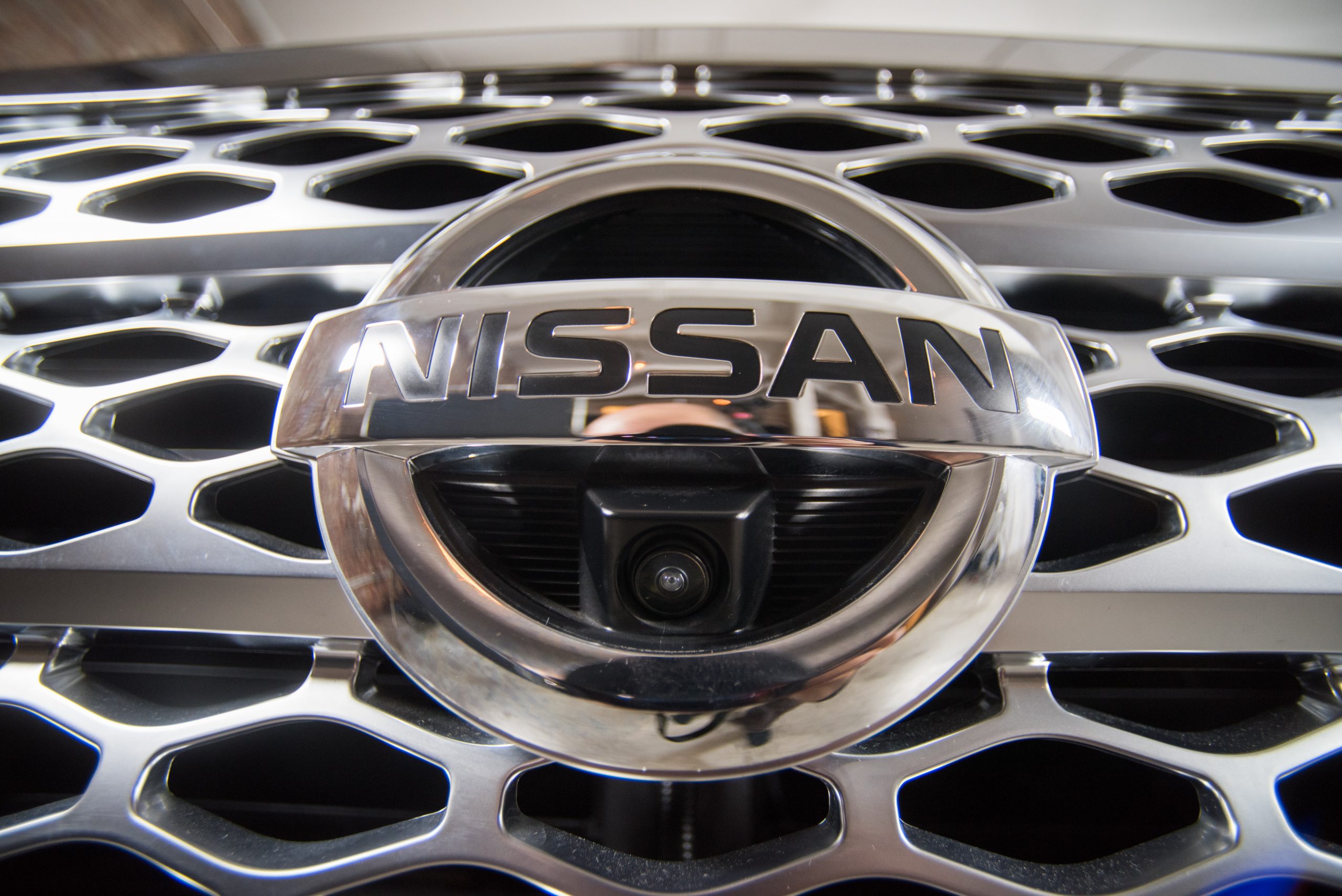 Upclose look at the grill and front camera of the Nissan Titan pickup truck