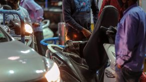 A customer refuels his motorcycle