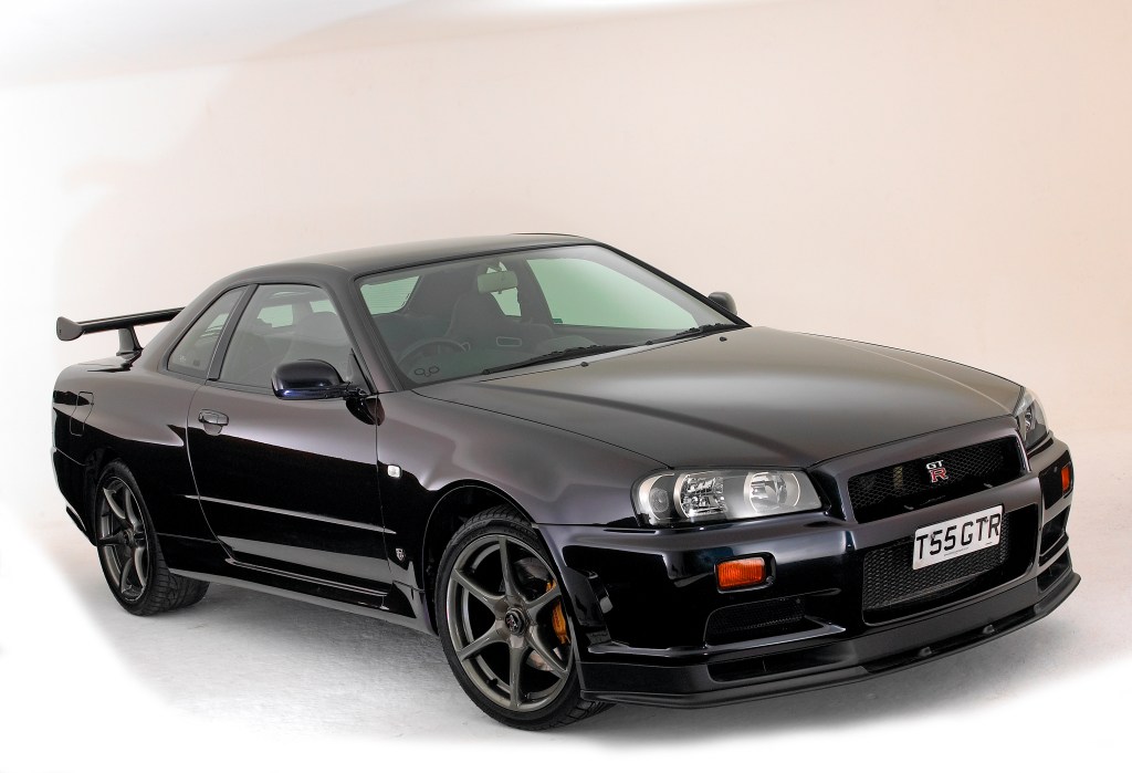 An image of a Nissan Skyline GT-R parked in a photo studio.