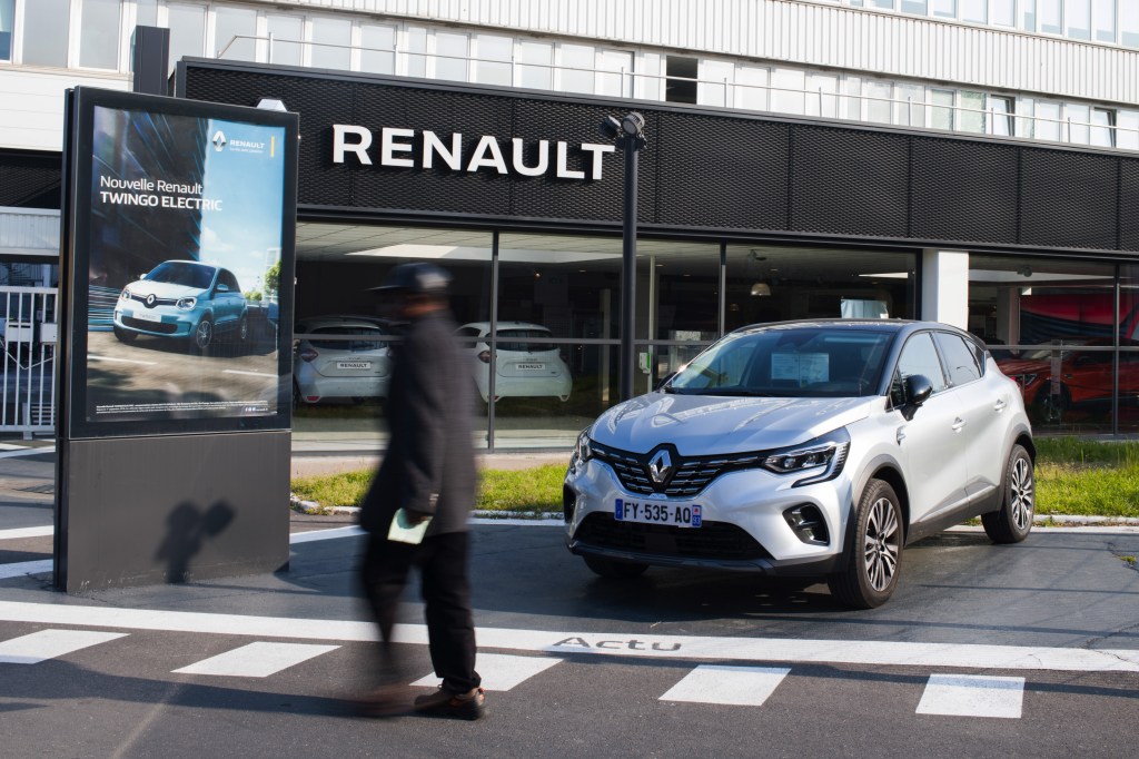 A man walks in to a Renault dealership
