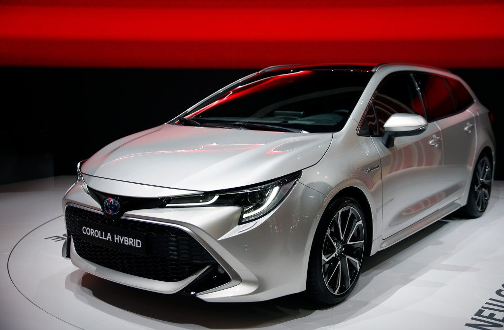 A silver Toyota Corolla shown under the lights at the Paris Motor Show