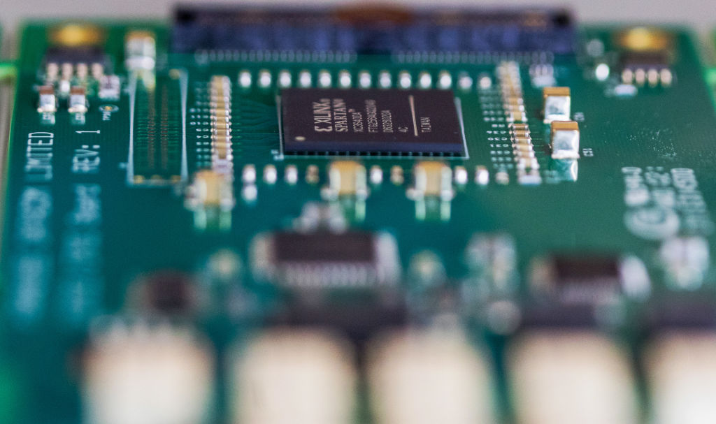 A semiconductor sits on a circuit board.