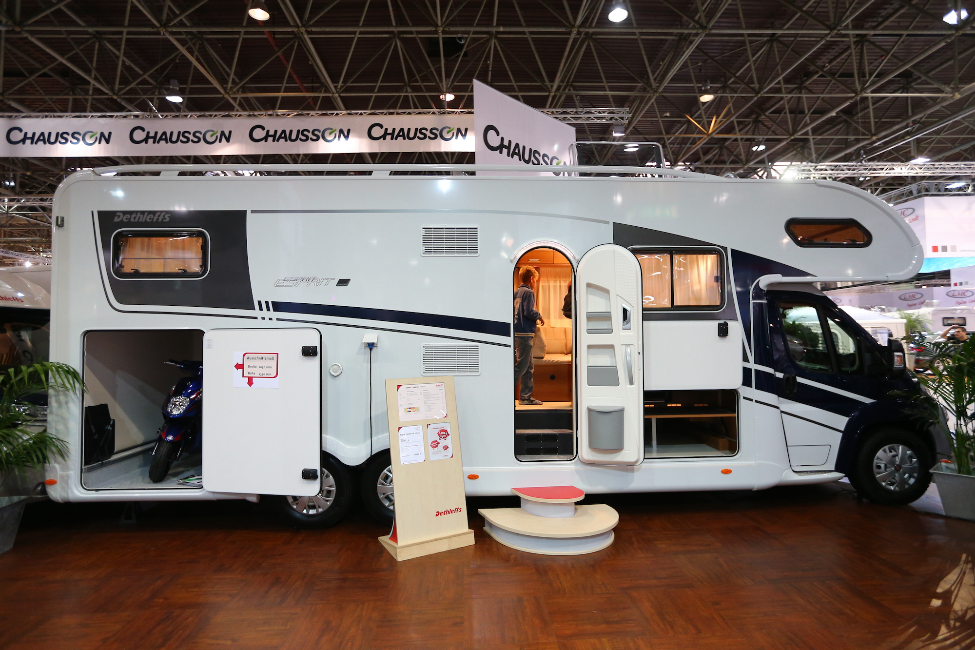 A toy hauler RV motorhome carrying a motorcycle at the Caravan Salon Duesseldorf expo in Duesseldorf, Germany, on September 4, 2014
