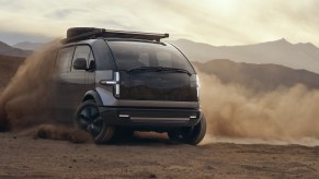 The 2022 Canoo Lifestyle van kicking up dirt
