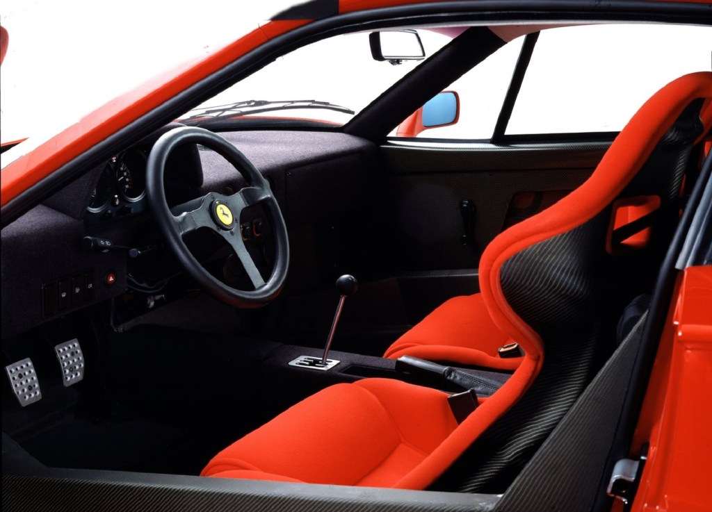 The carbon-fiber interior of a red 1987 Ferrari F40 with red seats