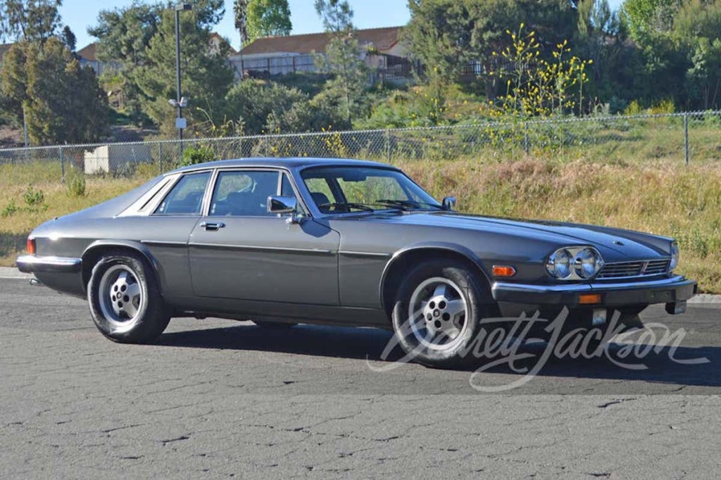 profile shot of blue 1987 Jaguar XJS sold at Barrett-Jackson 