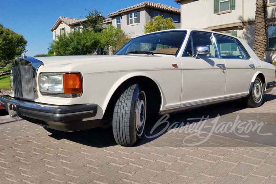 1989 Rolls-Royce Silver spur in profile parked in front of a house
