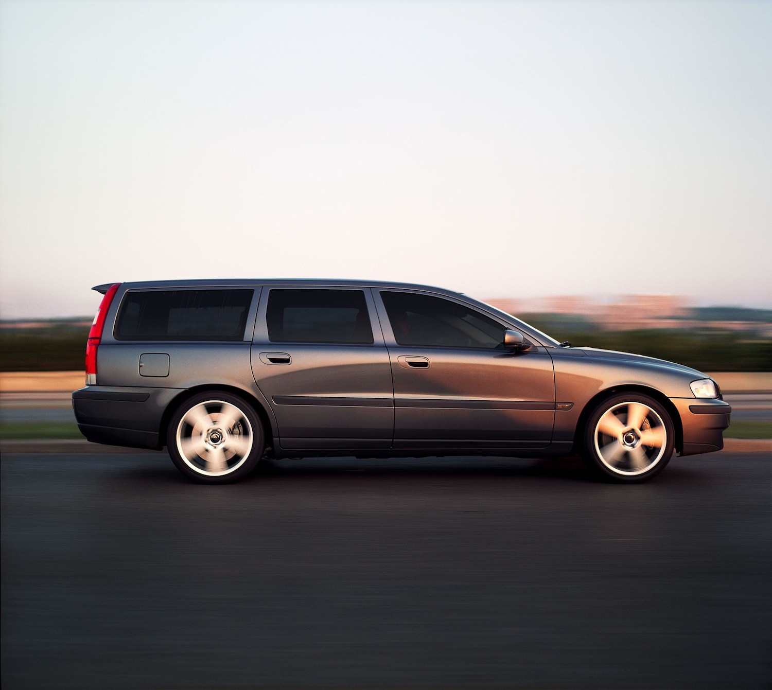 A grey 2003 Volvo V70 driving, one of the most interesting used cars under $1,000