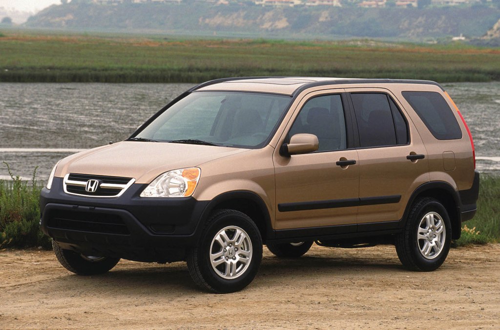 A gold 2004 Honda CR-V parked down by the river
