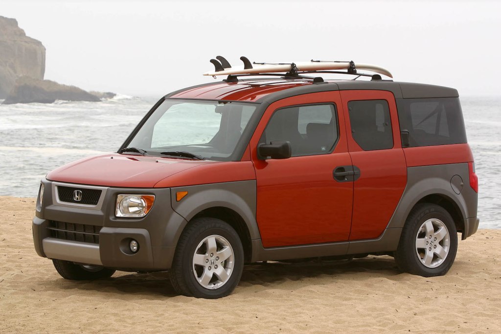 An orange 2004 Honda Element at the beach, the Element is one of the best cheap used SUVs under $5,000