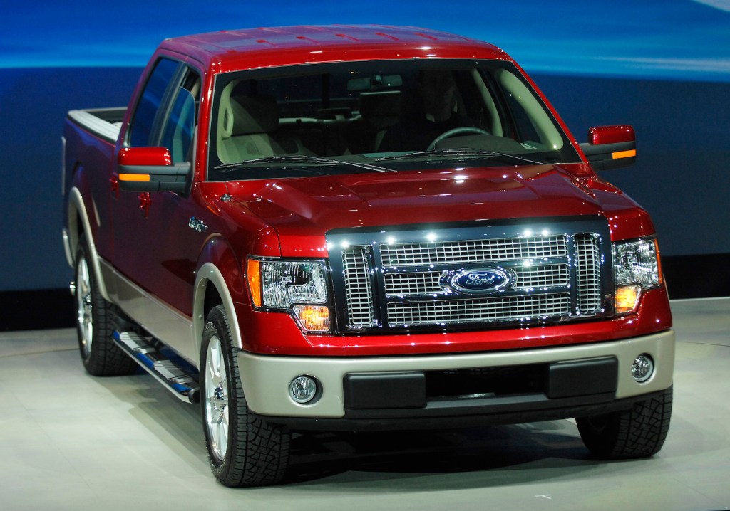 A red 2009 Ford F-150, an affordable used pickup under $25,000