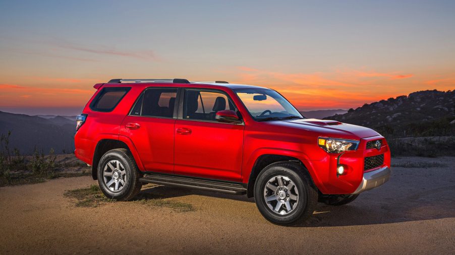 A red Toyota 4Runner at sunset