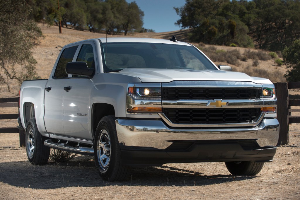 A silver 2016 Chevrolet Silverado parked, one of the best used trucks under $25,000
