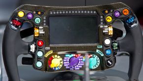 The carbon-fiber 2017 Mercedes F1 car steering wheel on a display stand