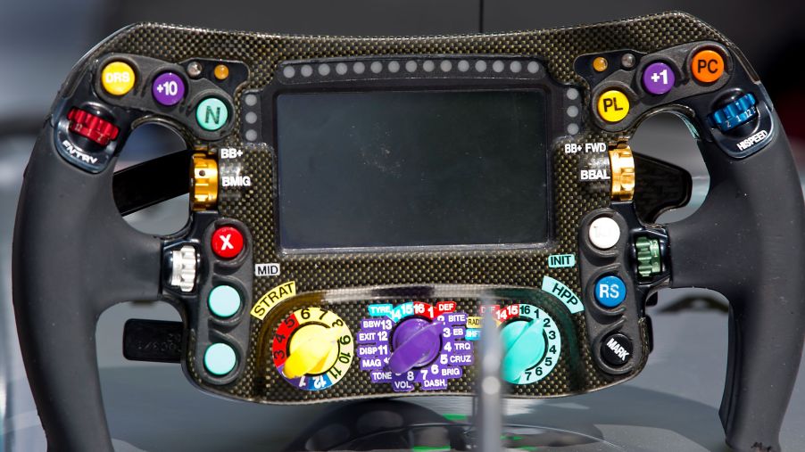 The carbon-fiber 2017 Mercedes F1 car steering wheel on a display stand