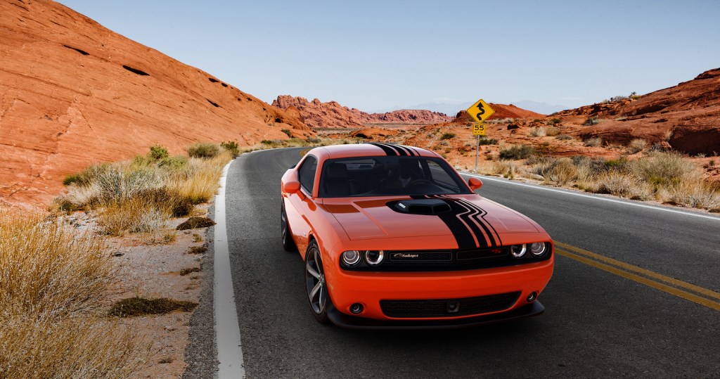 An orange 2018 Dodge Challenger, one of the best used sports cars for summer