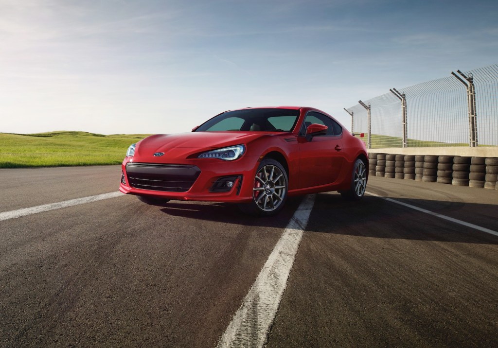 A red 2018 Subaru BRZ parked on the track, the BRZ is one of the best used sports cars for summer