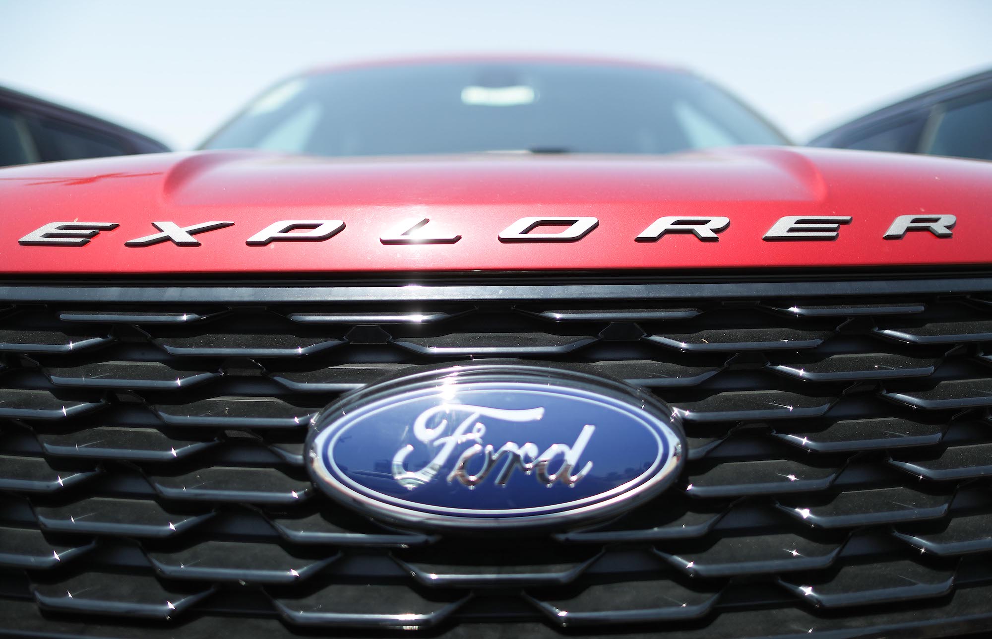 A red Ford Explorer SUV is parked for sale at a dealership on June 12, 2019, in Glendale, California
