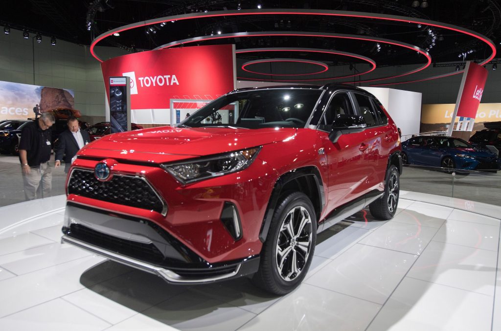 A red Toyota RAV4 SUV on display