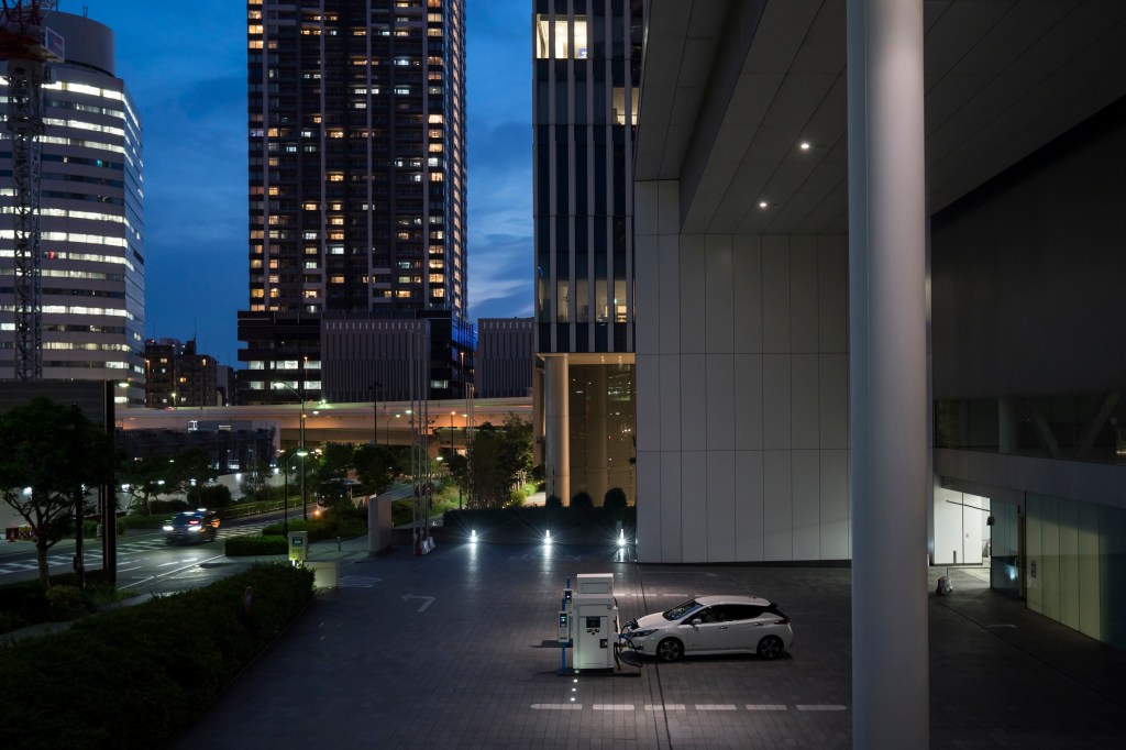 An overhead view of A Nissan Leaf EV charging