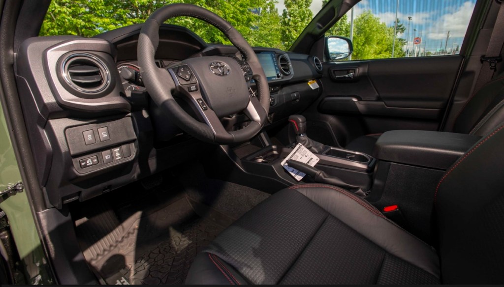 The black-and-red front interior of the one-millionth Tacoma, a 2020 Toyota Tacoma TRD Pro