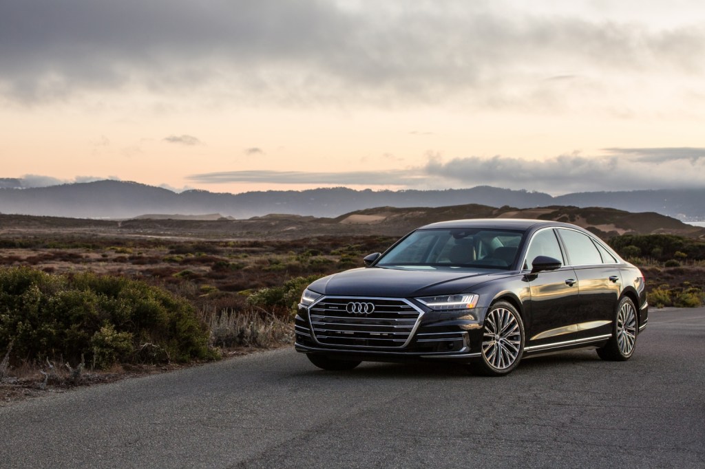 A 2021 Audi A8 parked by a mountain range, the 2021 Audi A8 is a spacious luxury sedan