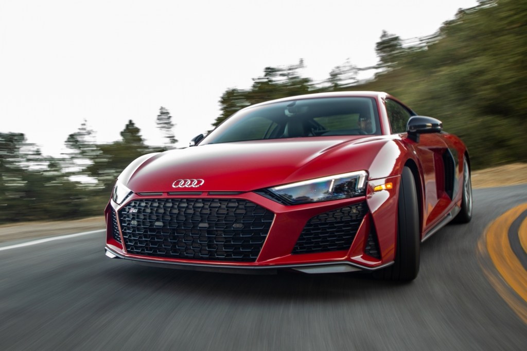 A red 2021 Audi R8 driving, the R8 is one of the best new sports cars with all-wheel drive